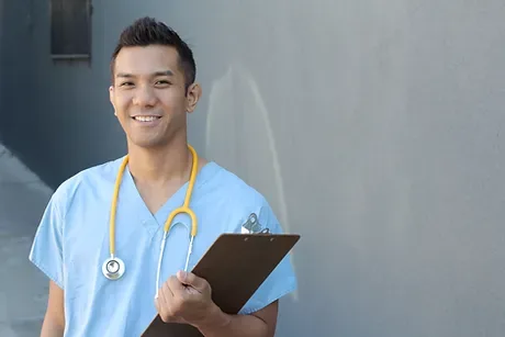 A healthcare worker holding a clipboard