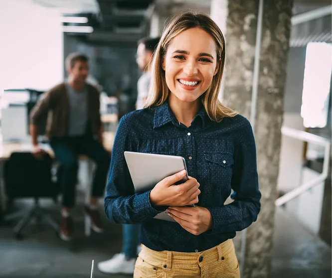 An employee smiling in an office
