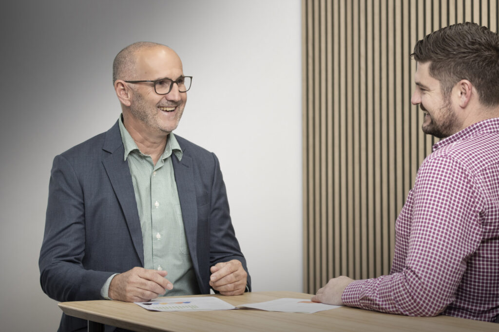 Rod Smith of People Management Partners in conversation during an HR strategy meeting.